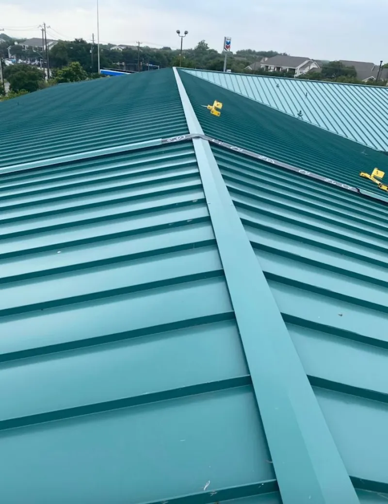 Green commercial metal roof ridge and valley for Metal Roof Repair in Niagara Falls